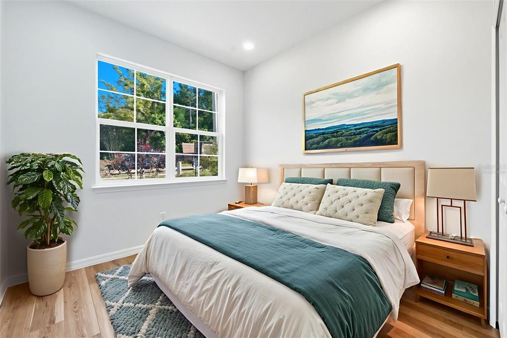 115 Leon Street Altamonte Springs, FL 32701 - Photo 10 of 15 a bedroom with a bed and a large window