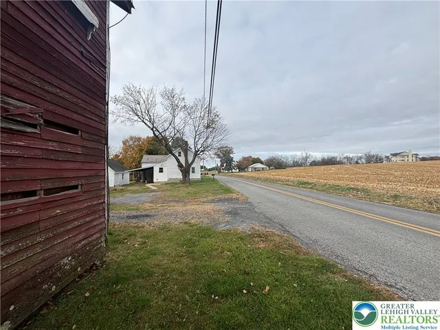 a view of a yard with an outdoor space
