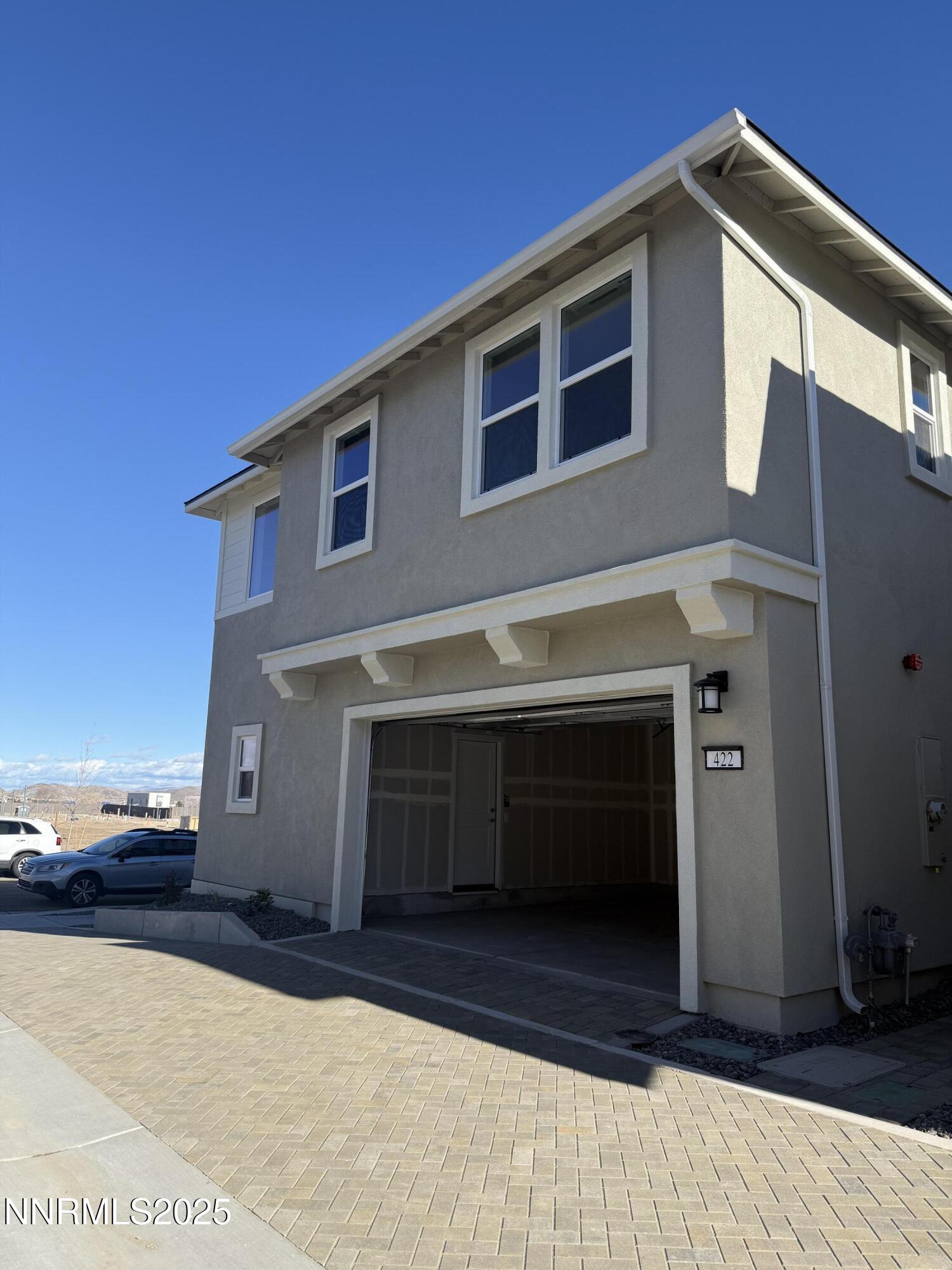 a front view of a house with a garage
