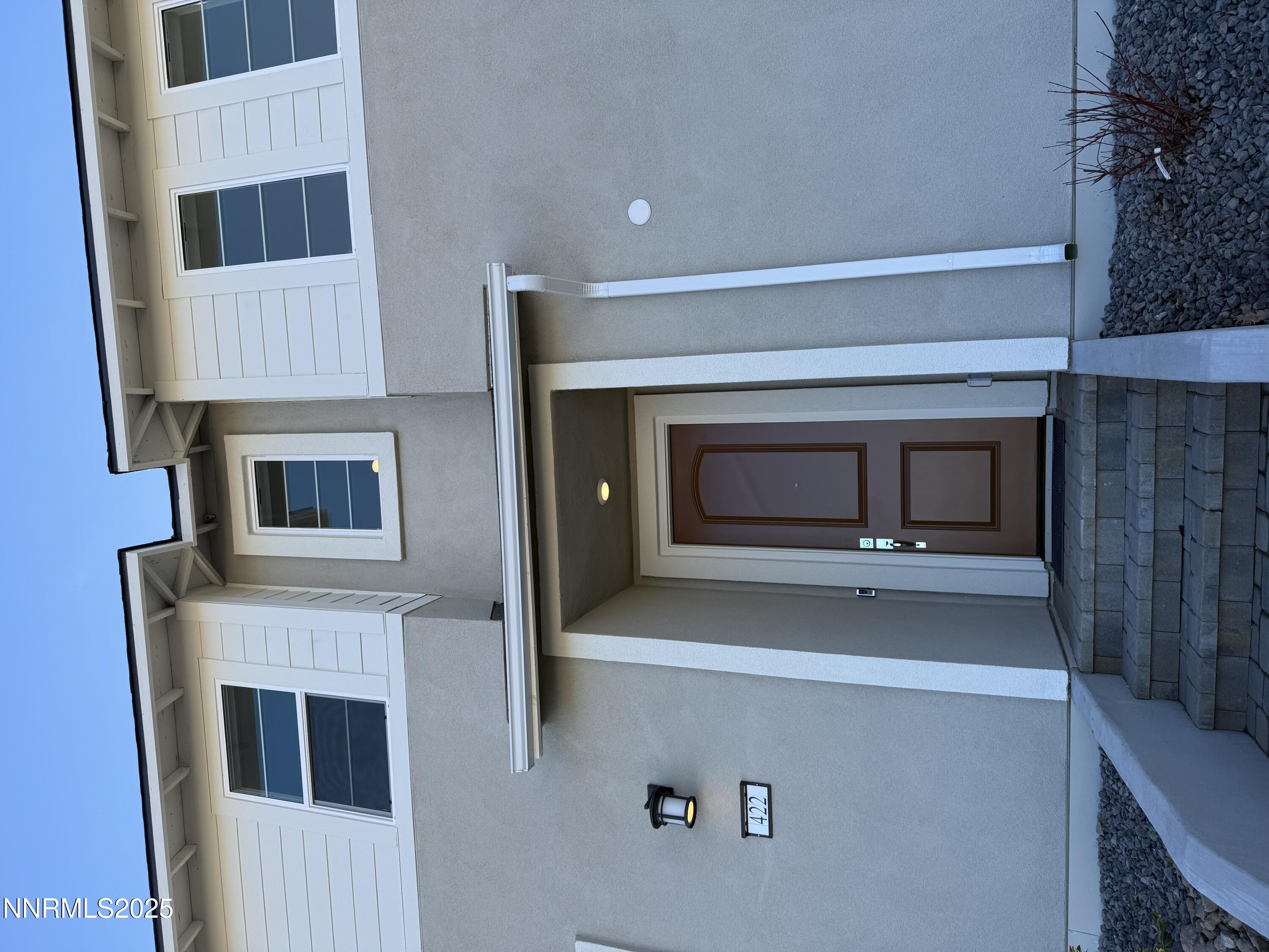422 Prosecco Way Reno, NV 89511 - Photo 3 of 3 a living room with a fireplace furniture and a potted plant