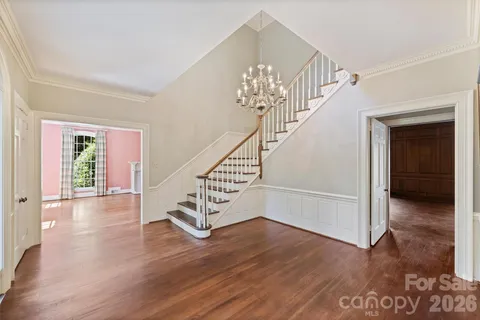wooden floor in an empty room with a window and wooden floor