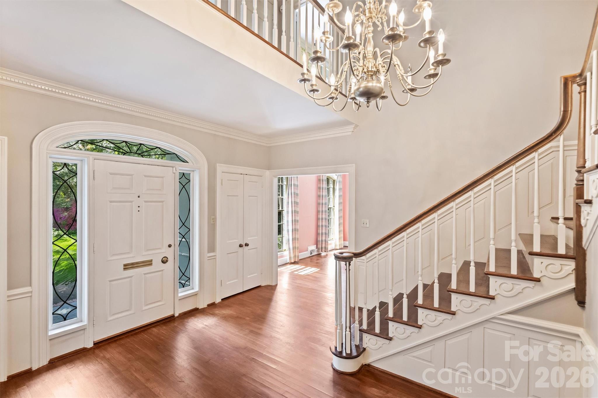 812 Ardsley Road Charlotte, NC 28207 - Photo 14 of 44 a view of entryway with wooden floor and stairs