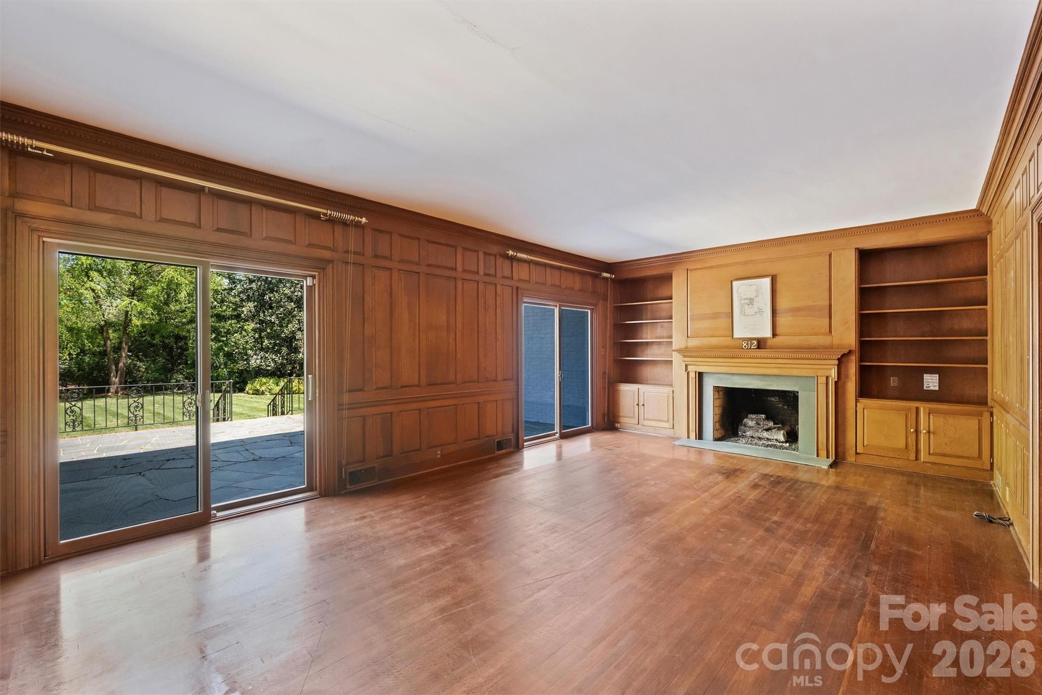 812 Ardsley Road Charlotte, NC 28207 - Photo 17 of 44 a view of an empty room with a fireplace and a window