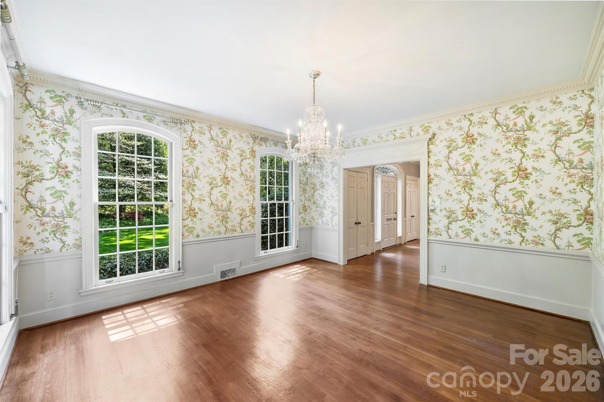 812 Ardsley Road Charlotte, NC 28207 - Photo 20 of 44 a view of an empty room with wooden floor and a window