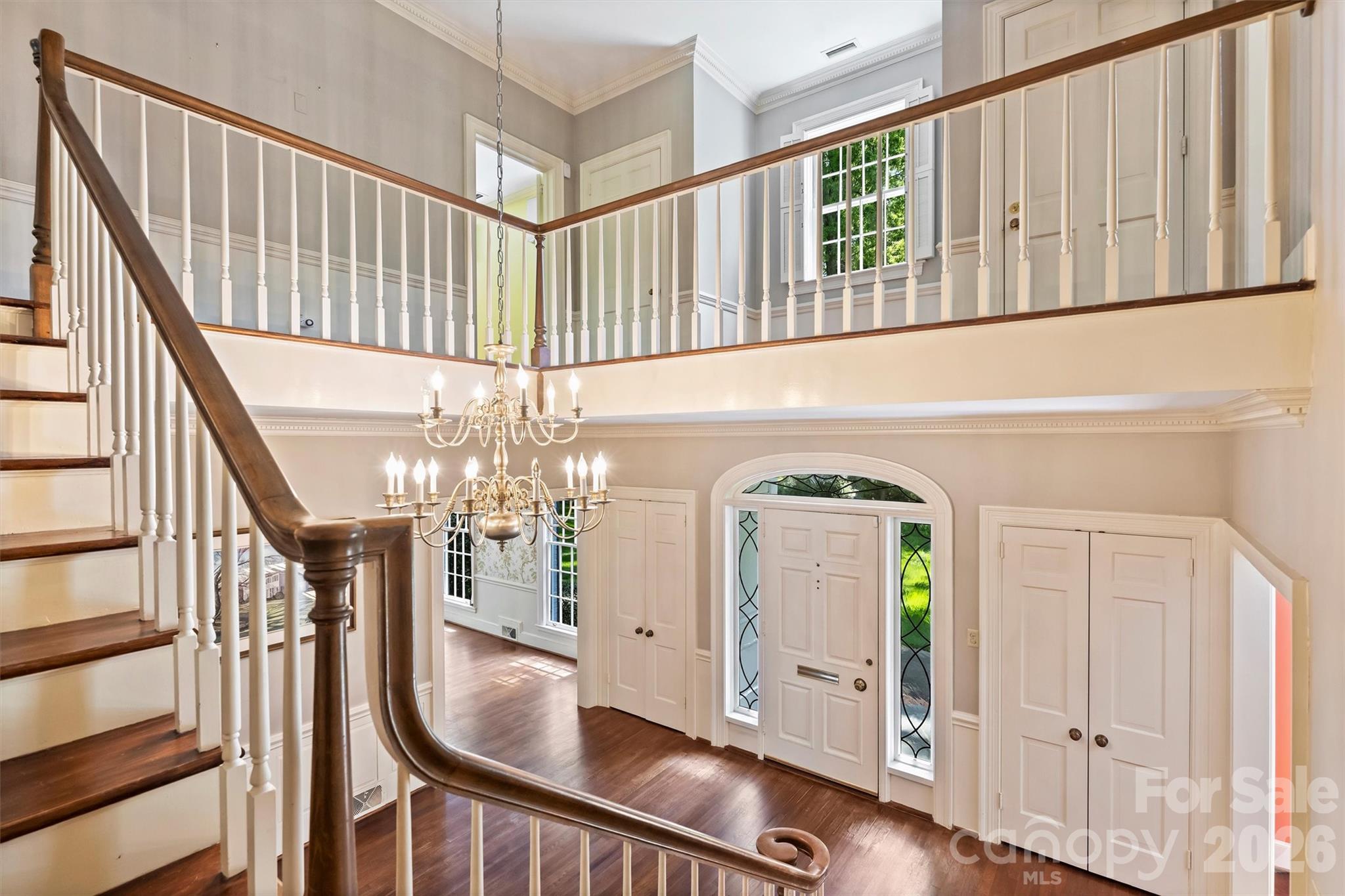 812 Ardsley Road Charlotte, NC 28207 - Photo 26 of 44 a view of a hallway with wooden floor and staircase