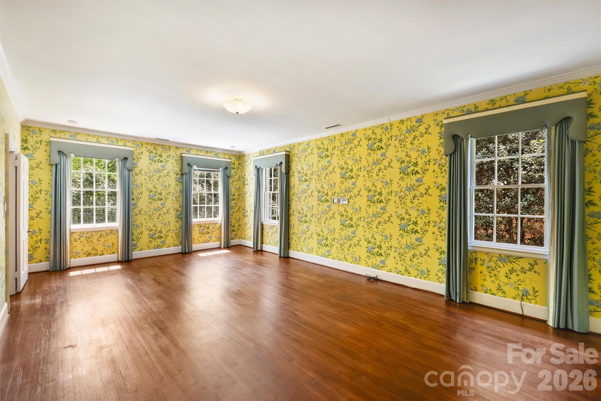 812 Ardsley Road Charlotte, NC 28207 - Photo 30 of 44 a view of an empty room with wooden floor and a window