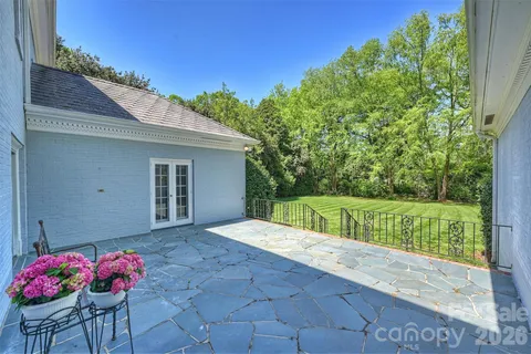 a view of backyard with outdoor seating