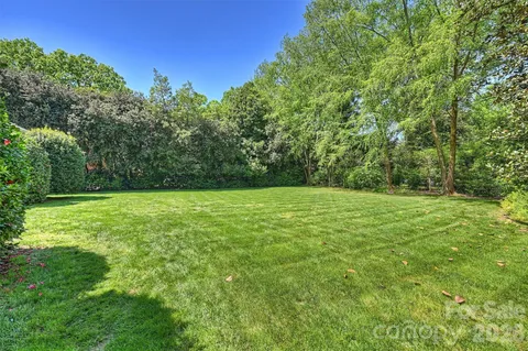 a view of outdoor space with deck and yard