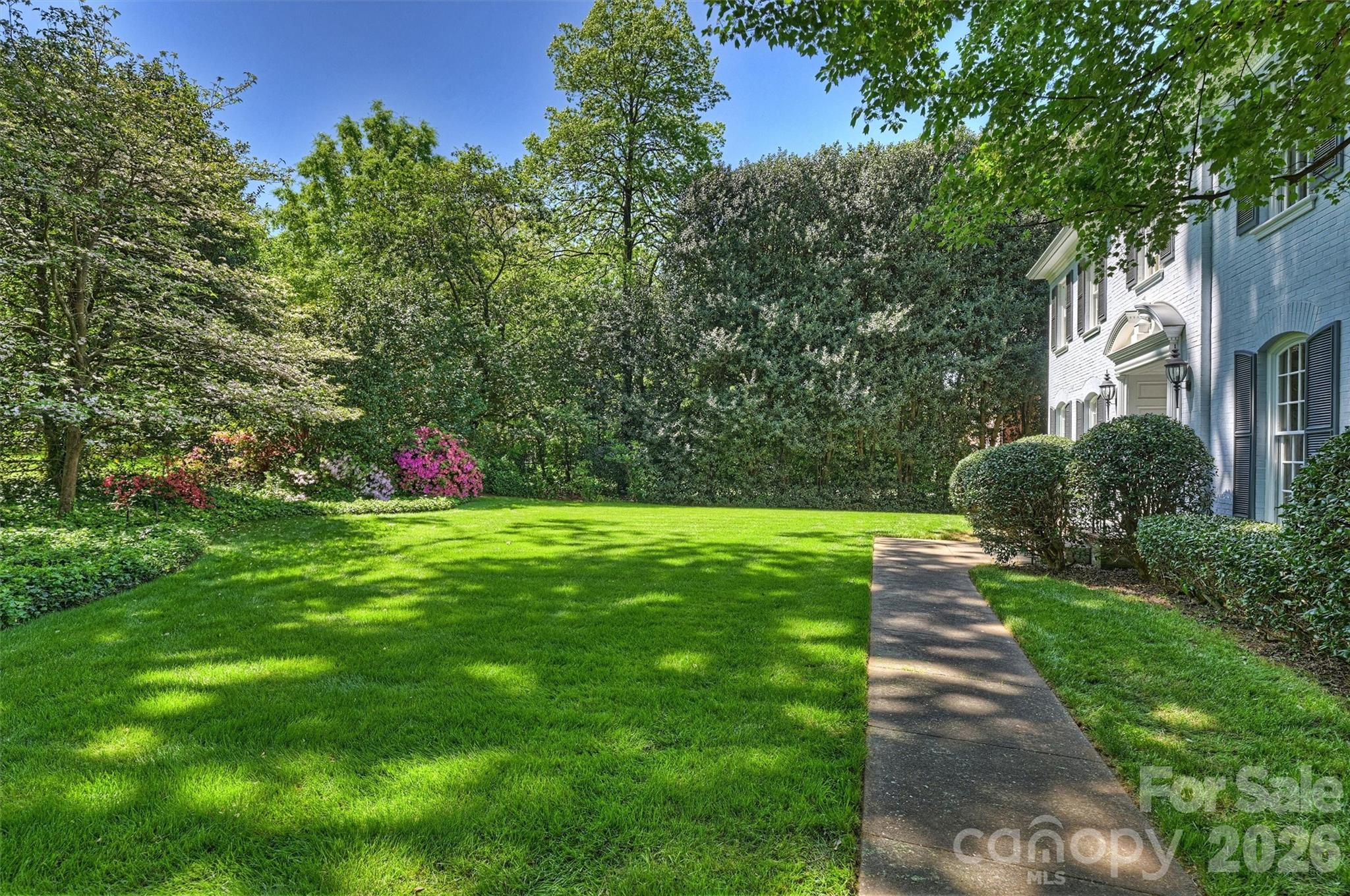 812 Ardsley Road Charlotte, NC 28207 - Photo 7 of 44 a view of a garden with flowers and trees