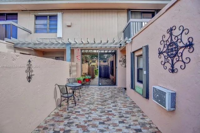 a view of a hallway with seating area