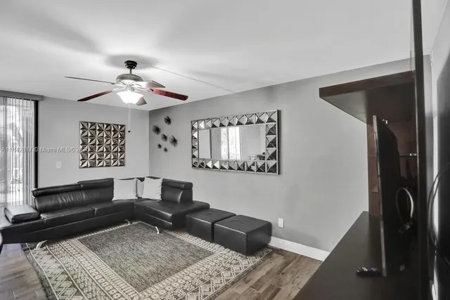 a living room with furniture and a rug