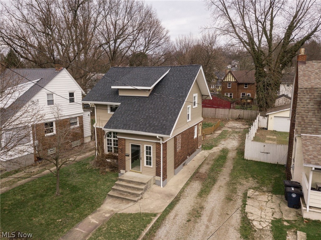 1603 Hampton Road Akron, OH 44305 - Photo 43 of 50 View of front facade featuring roof with shingles, brick siding, and a residential view