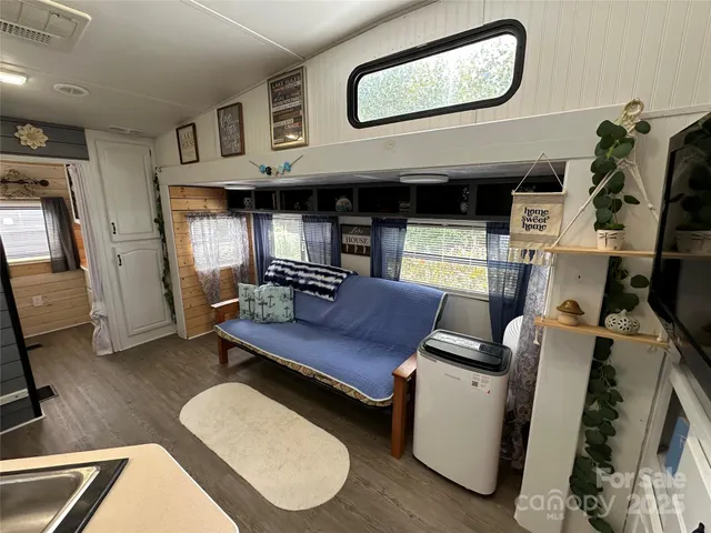 a room with furniture and a flat screen tv