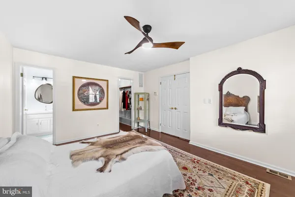 a bedroom with bed and a window