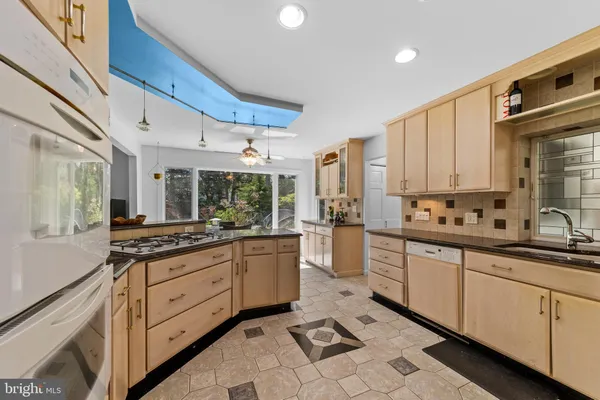 a large kitchen with a large window