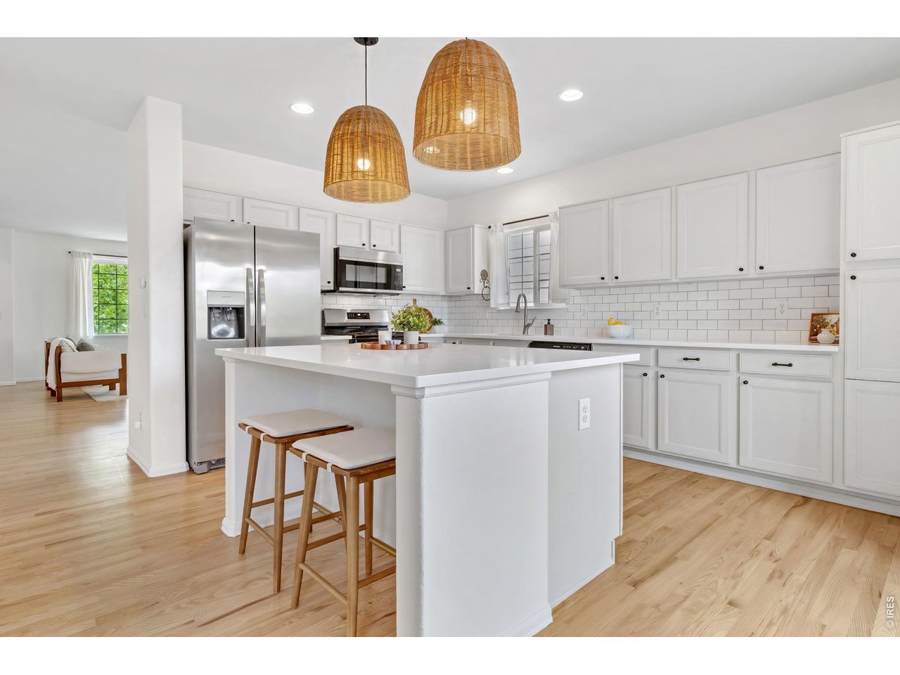2521 Azalea Way Erie, CO 80516 - Photo 12 of 47 The bright, spacious kitchen and center island invites lingering casual conversations with family or friends