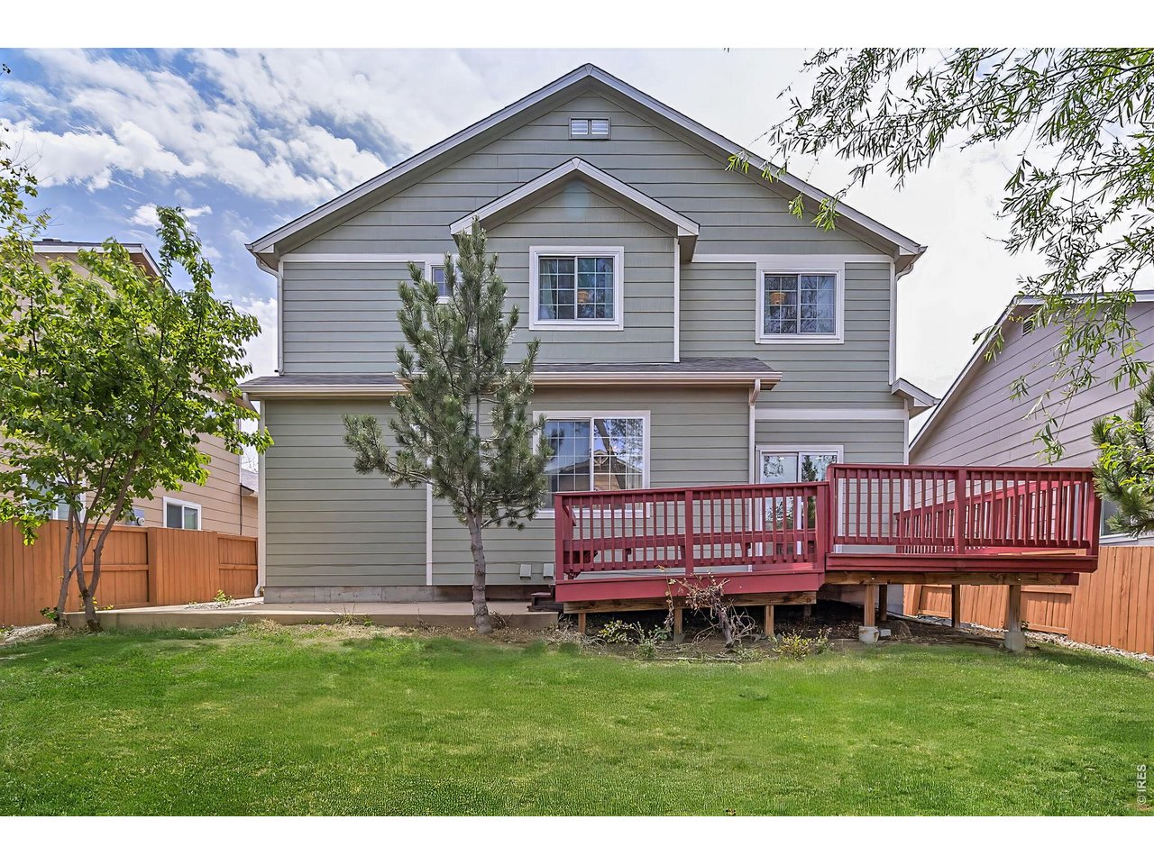 2521 Azalea Way Erie, CO 80516 - Photo 38 of 47 Back exterior with deck and fully fenced yard, perfect for indoor outdoor living, relaxing, entertaining, or pets