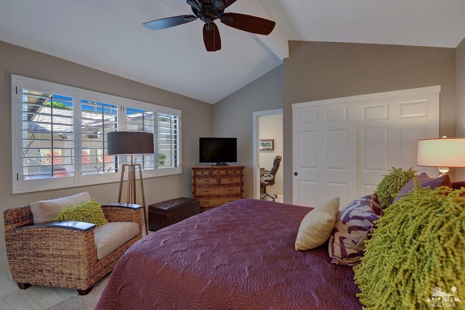 395 Red River Road Palm Desert, CA 92211 - Photo 20 of 29 a bedroom with a bed a window and a flat screen television