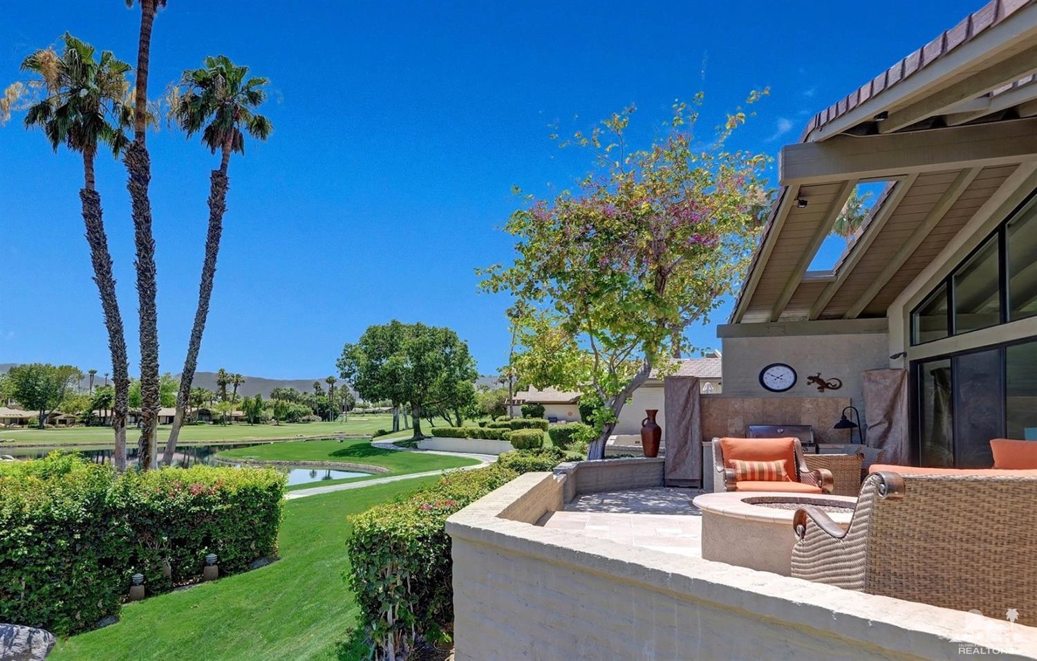 395 Red River Road Palm Desert, CA 92211 - Photo 25 of 29 a view of a house with a swimming pool