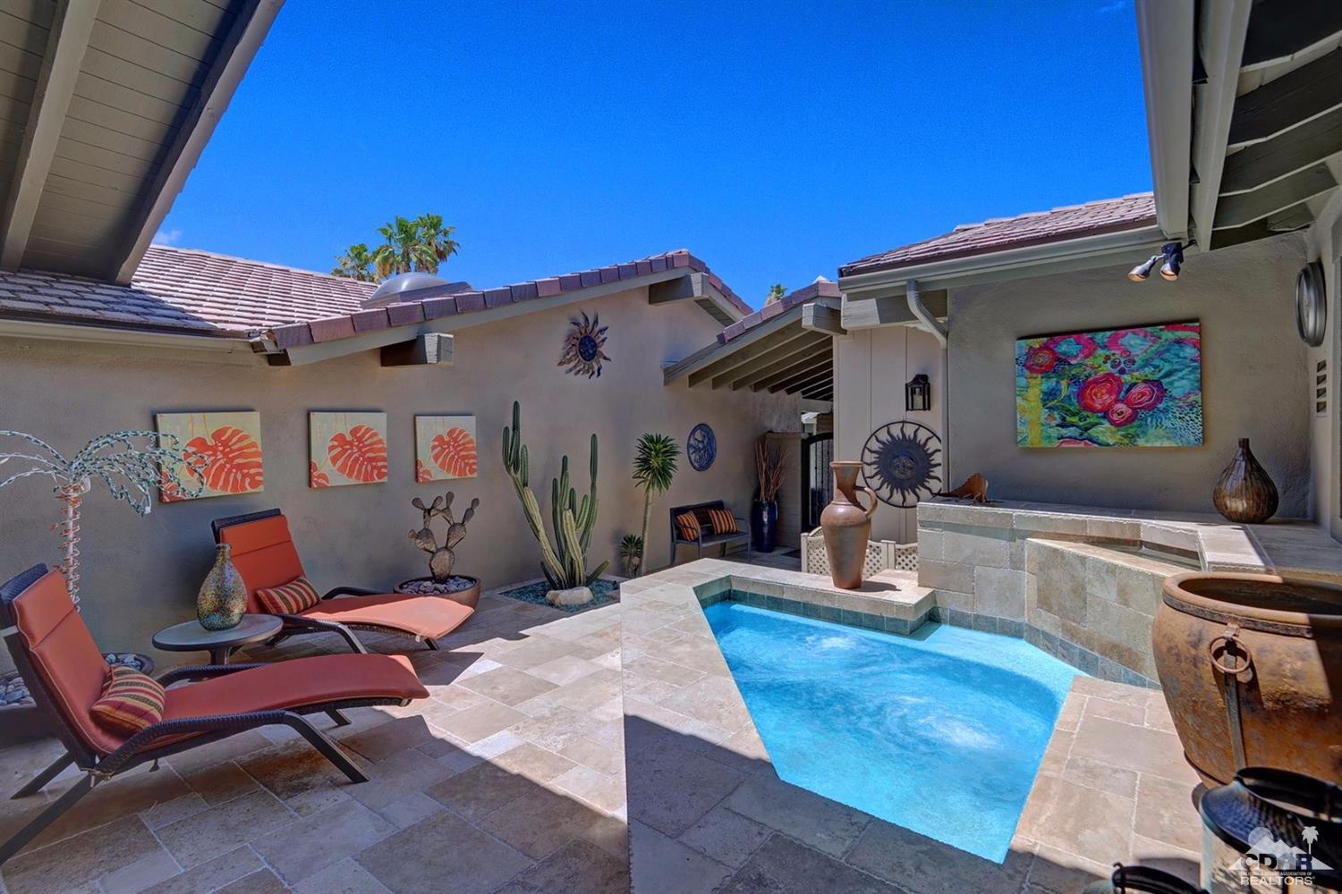 395 Red River Road Palm Desert, CA 92211 - Photo 28 of 29 a living room with furniture and a flat screen tv