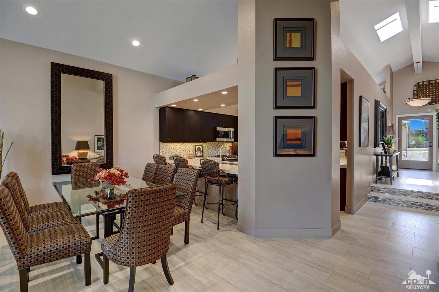 395 Red River Road Palm Desert, CA 92211 - Photo 8 of 29 a view of a livingroom with furniture and a flat screen tv