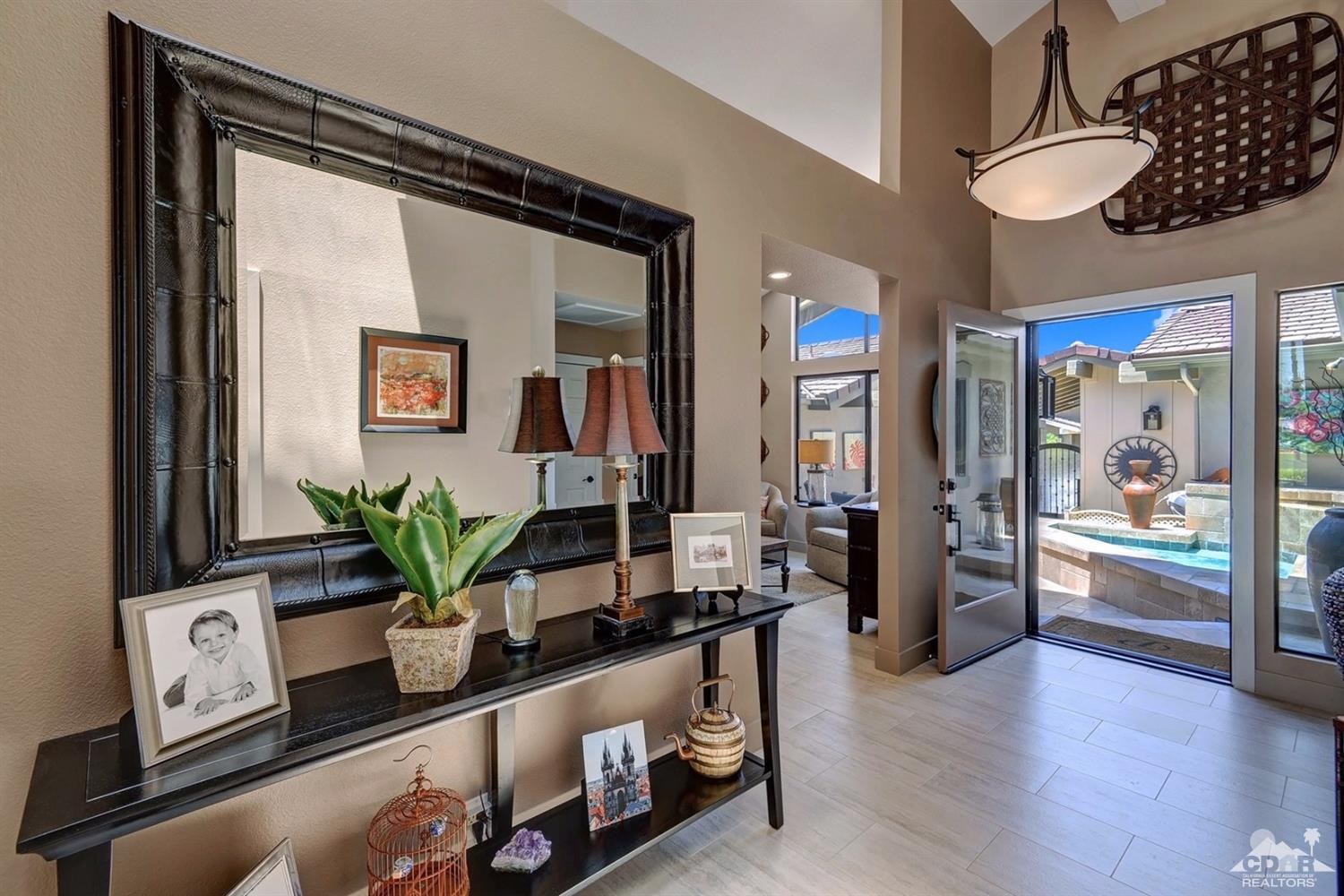 395 Red River Road Palm Desert, CA 92211 - Photo 9 of 29 a room with wooden floor and potted plant