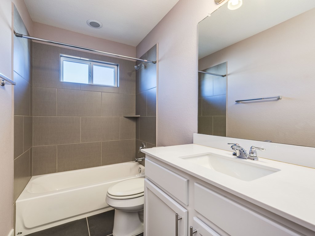 2208 Capulet Street Austin, TX 78741 - Photo 18 of 23 a bathroom with a sink a toilet and bathtub