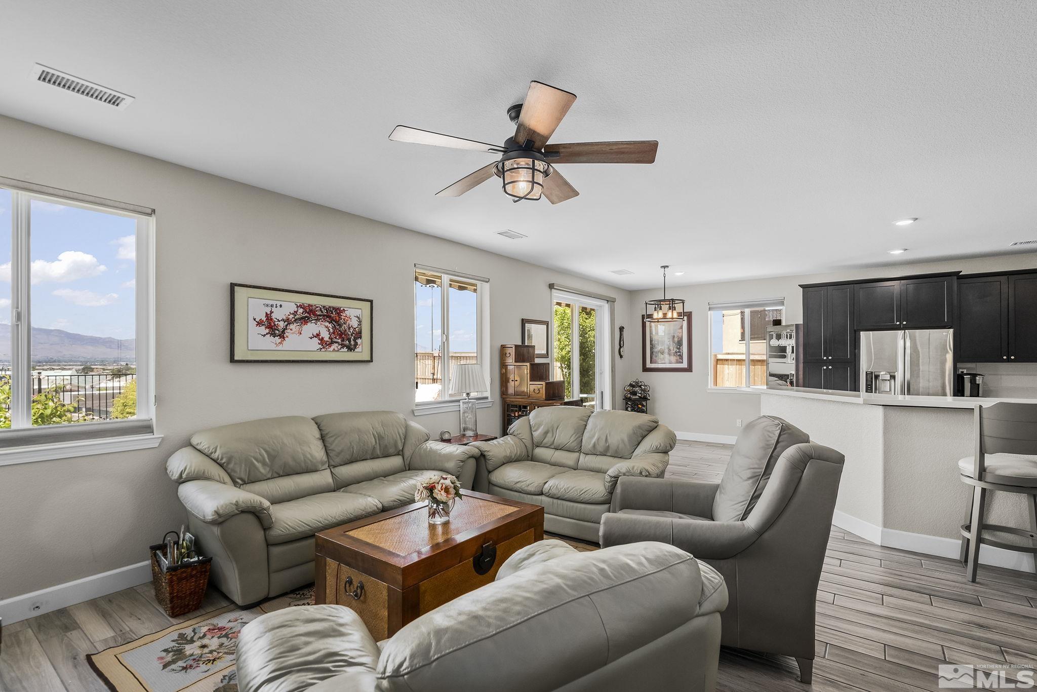 10325 Gold Mine Drive Reno, NV 89521 - Photo 3 of 38 a living room with furniture a ceiling fan and a window