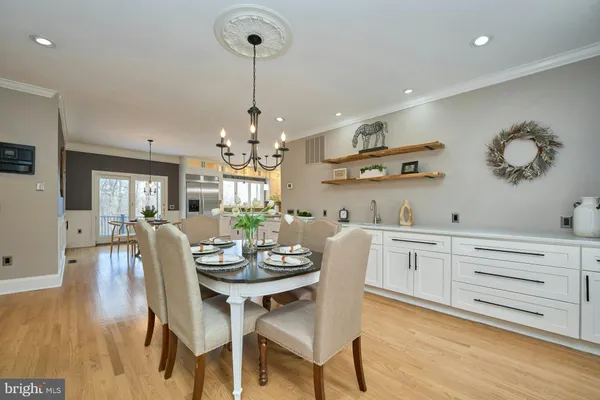 a kitchen with stainless steel appliances granite countertop a refrigerator a oven and a sink