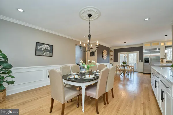 a kitchen with stainless steel appliances granite countertop a stove a sink dishwasher and a wooden cabinets