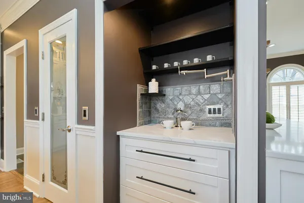 a bedroom with a bed and a table