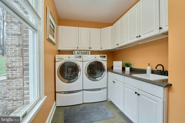 a view of backyard with swimming pool and outdoor seating