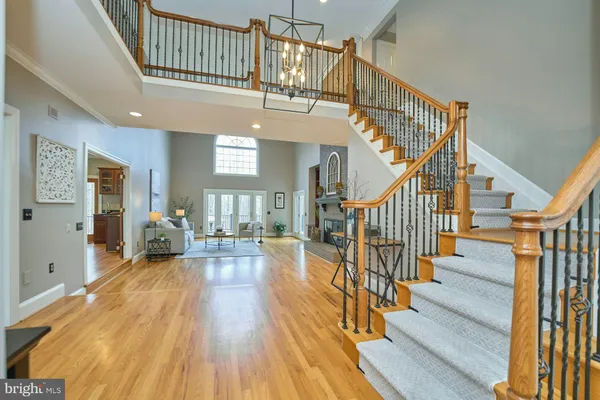 a view of entryway livingroom and hall with wooden floor