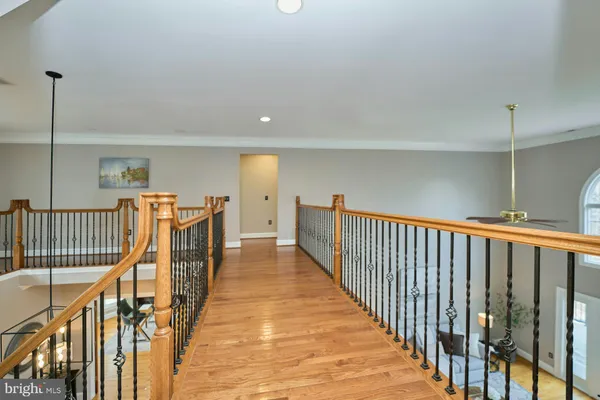 a view of walk in closet with clothes