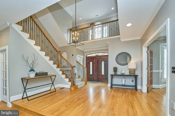 a living room with fireplace furniture and a wooden floor