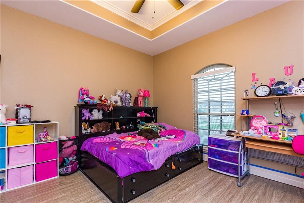 1306 Keenland Road Corpus Christi, TX 78418 - Photo 13 of 26 a bedroom with a bed and window