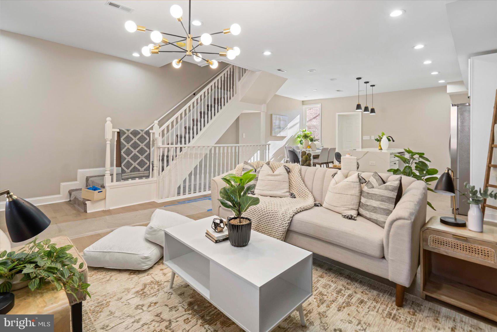 3919 Bonner Road Baltimore, MD 21216 - Photo 3 of 46 a living room with furniture potted plant and a chandelier