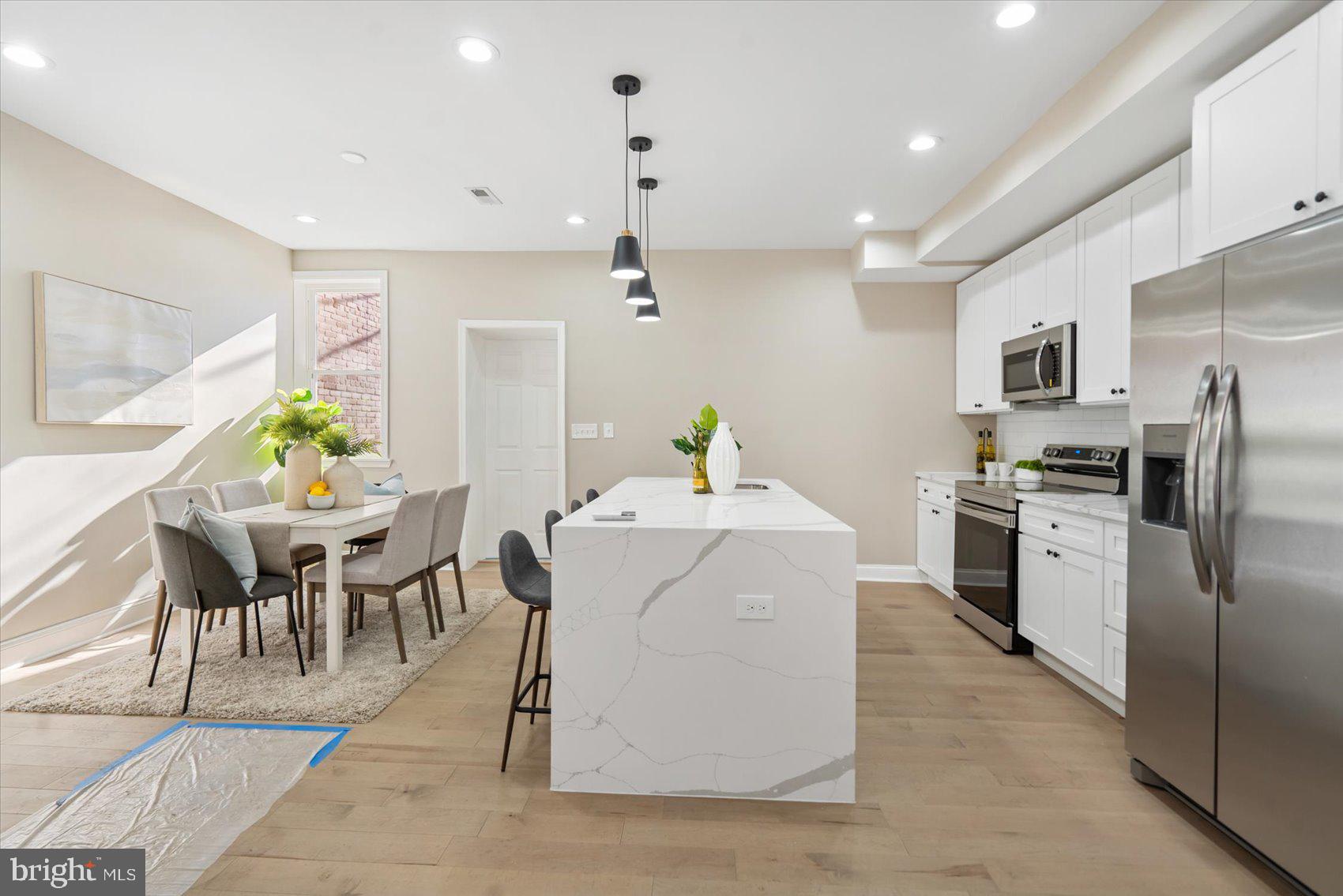 3919 Bonner Road Baltimore, MD 21216 - Photo 8 of 46 a kitchen that has a table and chairs in it