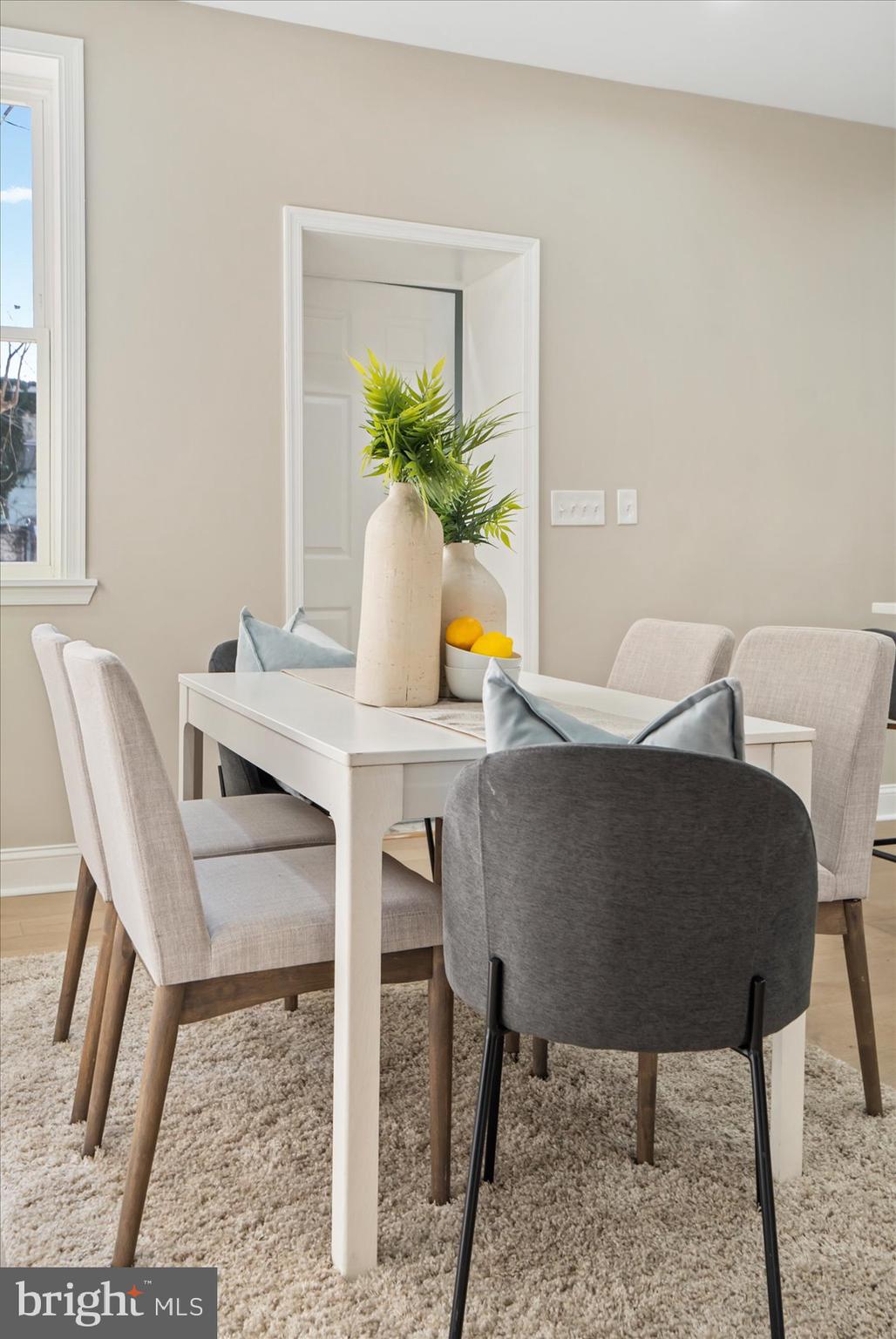 3919 Bonner Road Baltimore, MD 21216 - Photo 10 of 46 a dining room with furniture and a potted plant