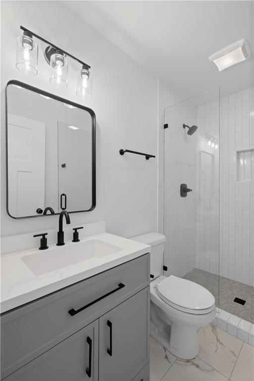 62 Bear Cub Ridge Big Canoe, GA 30143 - Photo 23 of 39 a bathroom with a toilet a sink and mirror