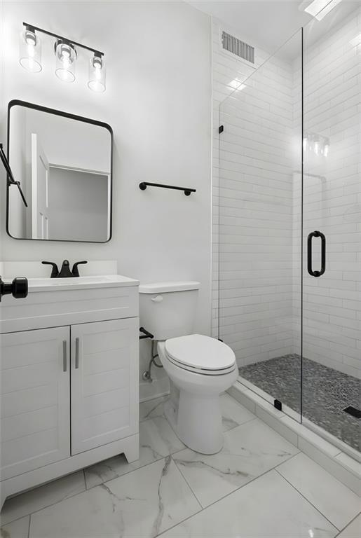 62 Bear Cub Ridge Big Canoe, GA 30143 - Photo 26 of 39 a bathroom with a toilet sink and shower