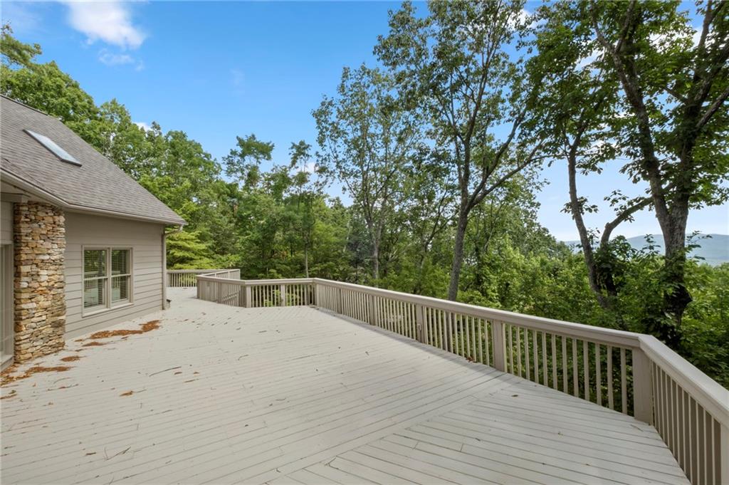 62 Bear Cub Ridge Big Canoe, GA 30143 - Photo 8 of 39 a view of backyard with deck and trees