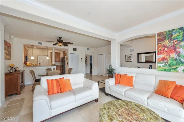 a living room with furniture and a couch