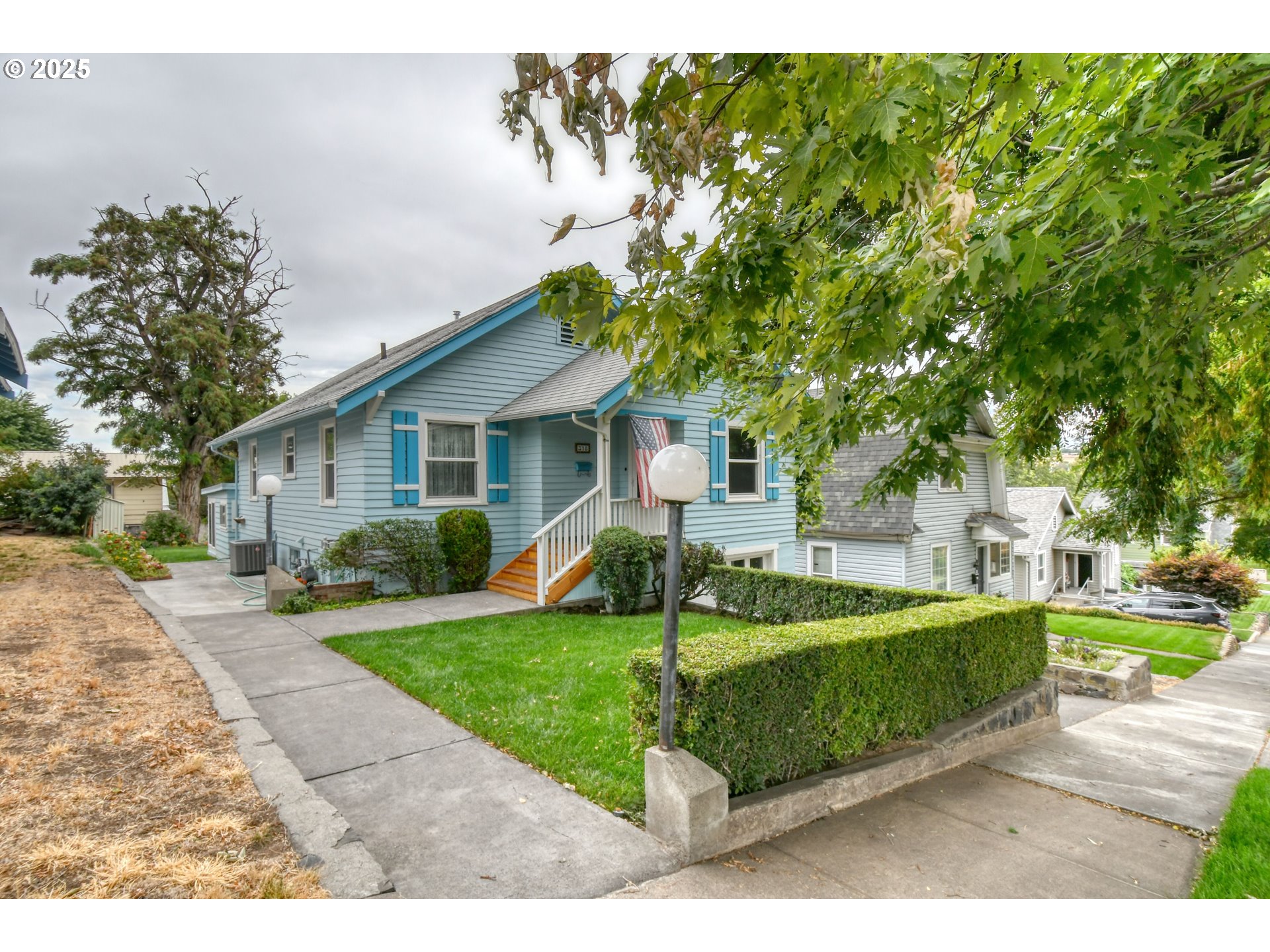 a front view of a house with garden