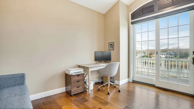 a workspace with furniture and a window