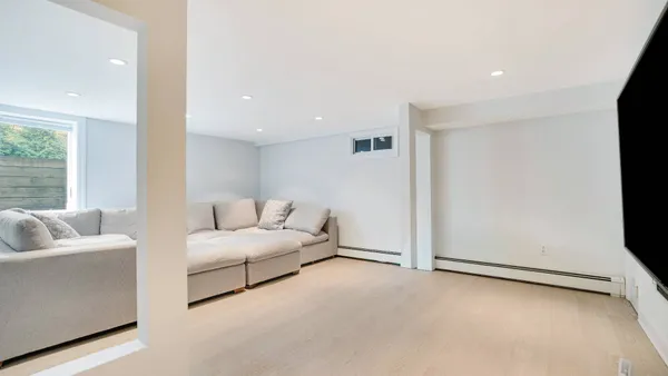 a living room with furniture and a couch