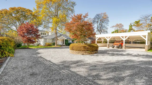 a view of house with outdoor space and tree