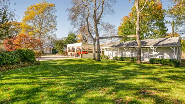 a view of a house with a big yard