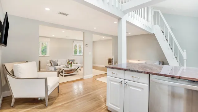 a living room with granite countertop furniture and a large window