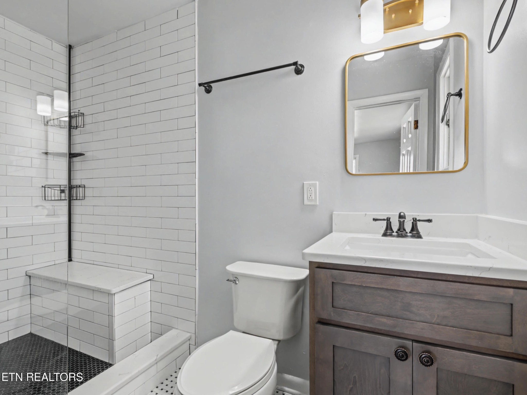 209 Wakefield Road Knoxville, TN 37922 - Photo 15 of 29 a bathroom with a sink a toilet and mirror